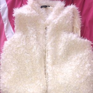 A white fur vest